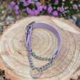 Lavender handmade BioThane dog collar with chain martingale displayed on natural wood, surrounded by purple flowers.