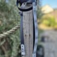 Lutchfords waterproof double-ended lead in navy and grey, displayed wrapped around weathered wooden post with metal clasps visible.