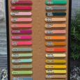 Comprehensive BioThane colour swatch chart displaying 32 vibrant handmade dog collar colour options from merlot to gold.