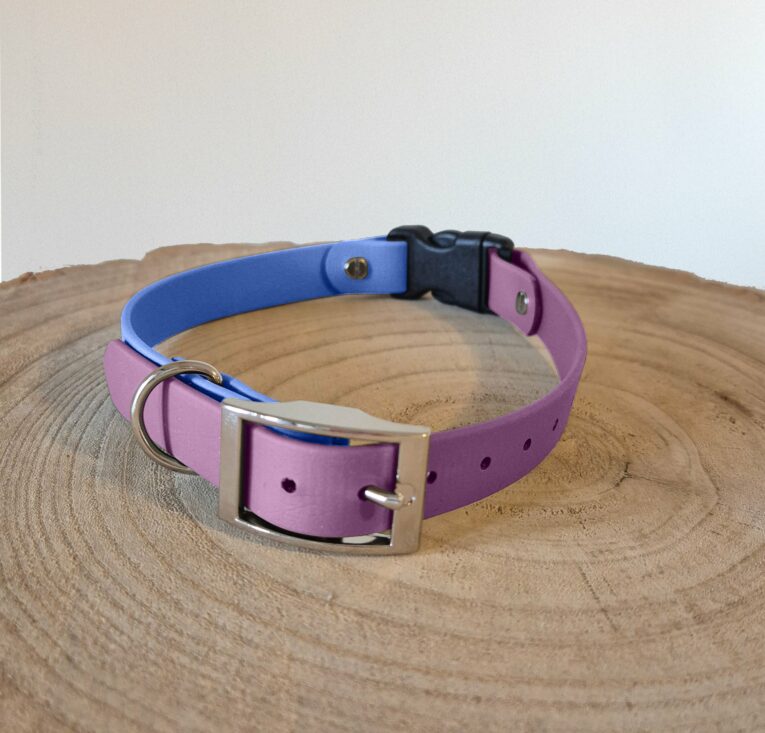 Purple and blue handmade BioThane dog collar with metal buckle on wooden surface.