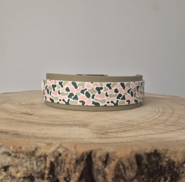 Handmade BioThane hound collar with dual-layer design, featuring pink, black and cream abstract patterned webbing on natural-coloured base.