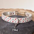 Handmade BioThane slip collar with red horse and horseshoe print design, featuring metal fittings and matching lead.
