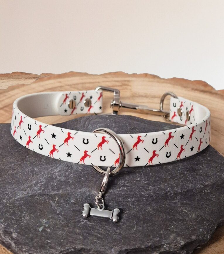 Handmade BioThane slip collar with red horse and horseshoe print design, featuring metal fittings and matching lead.