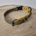 Handmade BioThane dog collar replacement strap in grey with yellow accent detail and metal fittings.
