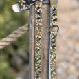 Camouflage handmade BioThane dog collar with 'GUNNER' label, displayed on wooden post with rope.