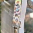 Colourful handmade dog collar with floral print design, rhinestone embellishments, and metal hardware