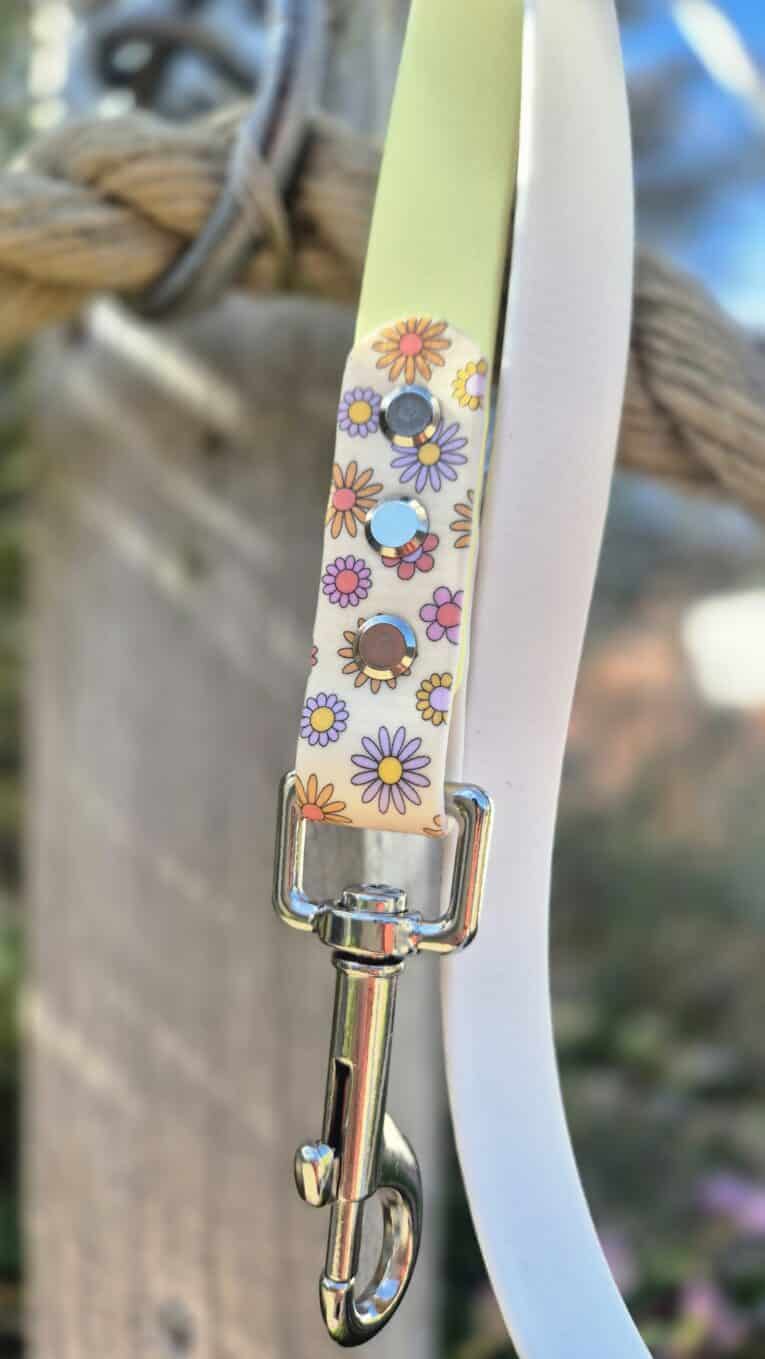 Colourful handmade dog collar with floral print design, rhinestone embellishments, and metal hardware