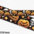 Halloween-themed printed BioThane dog collar featuring jack-o'-lantern pumpkins, skulls and stars on black background