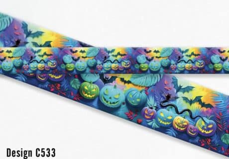 Vibrant Halloween-themed printed dog collar featuring jack-o'-lanterns, bats, spiders and tropical foliage in purple, yellow and teal tones.