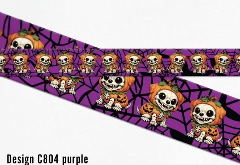 Purple Halloween pumpkin skeleton dog collar with spider web pattern design and spooky printed characters