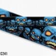 Bold blue skull zombie design on handmade BioThane dog collar with glowing orange eyes and yellow teeth detail.