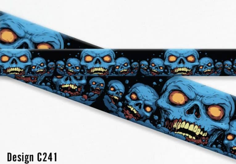 Bold blue skull zombie design on handmade BioThane dog collar with glowing orange eyes and yellow teeth detail.